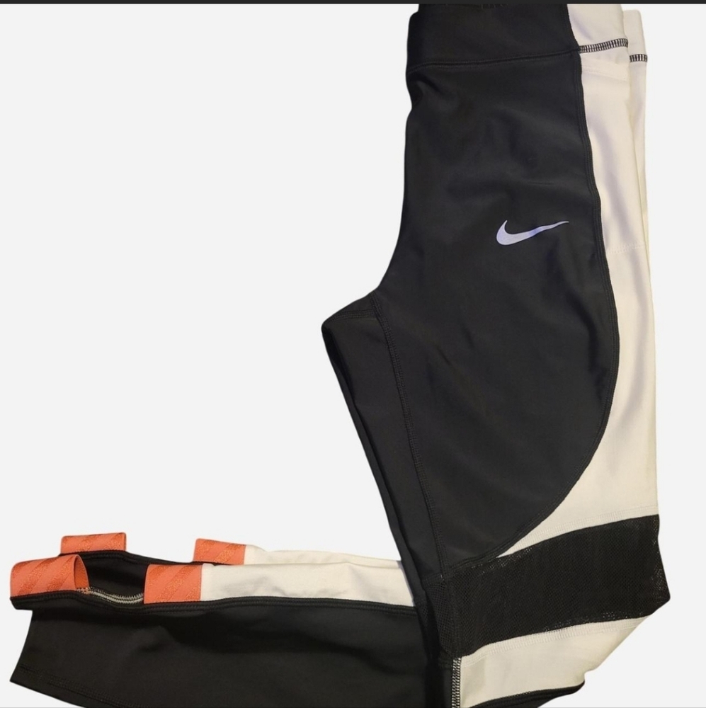 Nike Black and White Leggings with Vibrant Orange Details